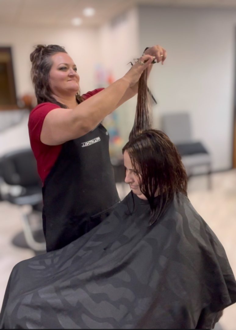 Kitti cutting hair in the studio